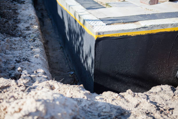Professional Waterproofing technician working in Lindenhurst, NY